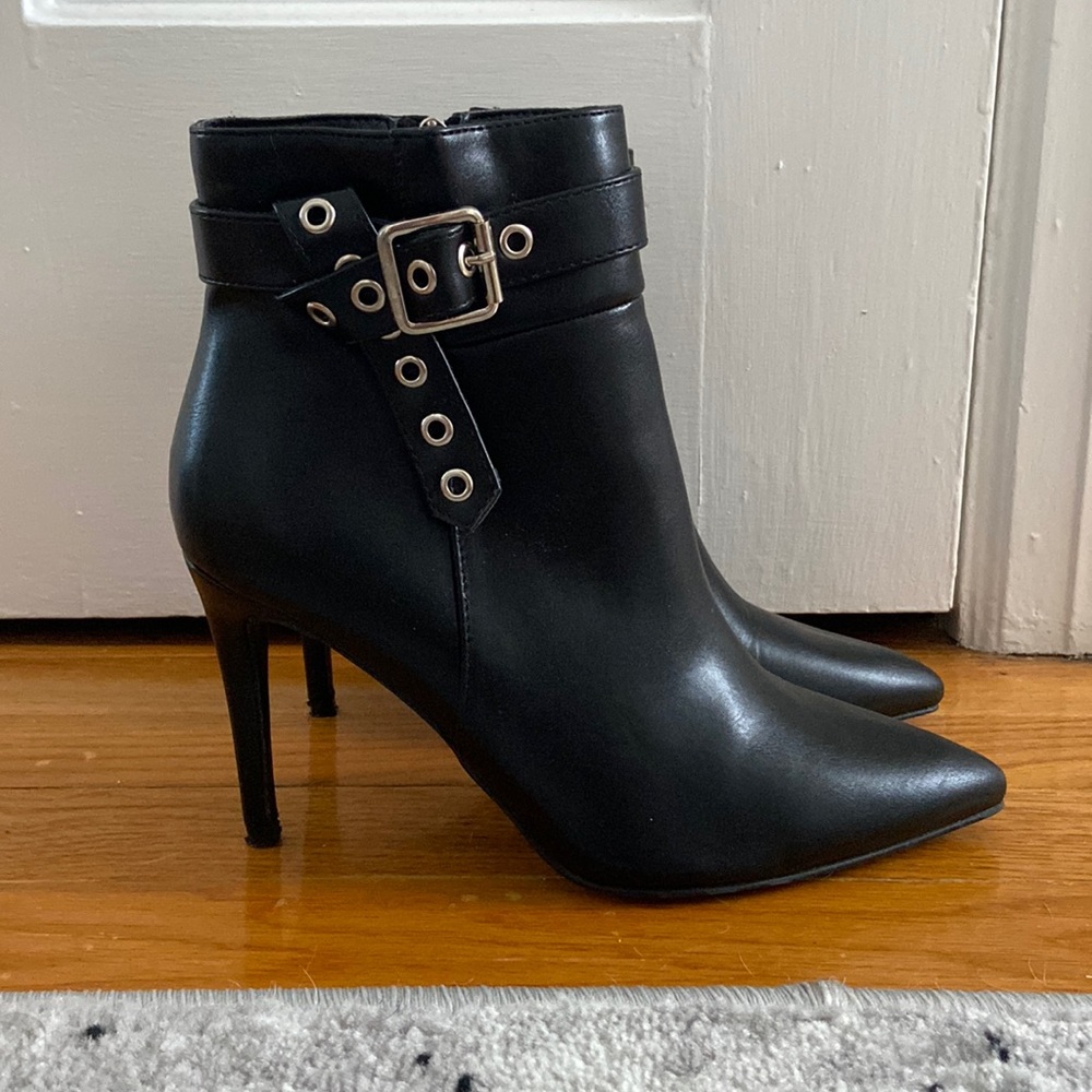 Lulus booties with grommet details around ankle.